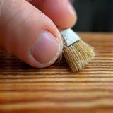 Icon representing high-quality wood finishing guidance